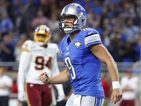 Detroit Lions quarterback Matthew Stafford clenches his fist after a touchdown pass to wide receiver Anquan Boldin during the second half of an NFL football game against the Washington Redskins on Oct. 23, 2016 in Detroit.