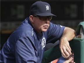 Hitting coach Wally Joyner of the Detroit Tigers watches action from the dugout at Comerica Park on September 15, 2016.