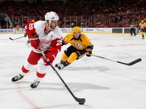 Steve Ott, left, of the Detroit Red Wings looks to get around the defence of Viktor Arvidsson of the Nashville Predators during the first period at Joe Louis Arena on Oct. 21, 2016 in Detroit.