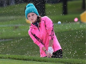 Tess Scaman of Chatham-Kent Secondary School hits out of a bunker on Oct. 15, 2015 during the OFSAA girls' golf festival at Roseland Golf Club in Windsor, Ont.