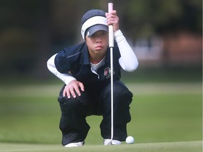 Jasmine Ly of Holy Names lines up a putt during the OFSAA girls' golf festival at Roseland Golf and Curling Club in Windsor, Ont., on Oct. 13, 2016.