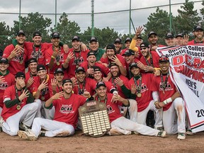 Members of the St. Clair men's baseball team celebrate after winning their fourth straight OCAA championship on Oct. 23, 2016 in Etobicoke.