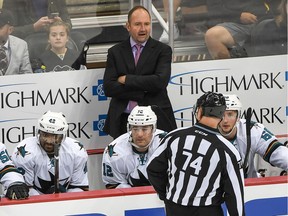 San Jose Sharks head coach Peter DeBoer has a word with linesman Lonnie Cameron #74 in the second period during the game against Pittsburgh Penguins at PPG PAINTS Arena on October 20, 2016 in Pittsburgh, Pennsylvania.