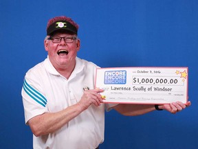 Lawrence Scully of Windsor with the $1 million prize cheque he won by playing ENCORE on a Lotto MAX ticket.