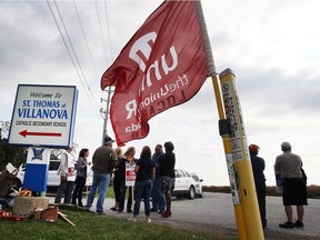 Striking support staff with the Windsor-Essex Catholic District School Board are shown at one of the main entrances to Villanova high school on Oct. 18, 2016.