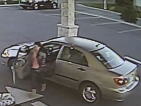 Surveillance photo of a woman accused of allegedly striking a man with her vehicle and fleeing the scene on Sept. 25, 2016.