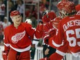 Detroit Red Wings left-winger Teemu Pulkkinen (56) celebrates his goal against the Minnesota Wild in the first period of an NHL hockey game in Detroit on Jan. 20, 2015.