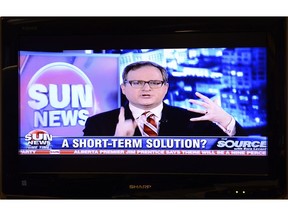 "The Source with Ezra Levant" program is show on a television in Toronto on Thursday Feb. 12, 2015. The Sun News Network is shutting down Friday morning after negotiations to sell the troubled television network were unsuccessful.