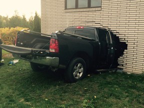 A black Dodge pick-up truck that crashed into the rear wall of the Consulate of Mexico building in Leamington on Oct. 23, 2016.