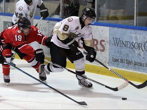 The LaSalle Vipers Jack Bowler carries the puck around the net ahead of the Leamington Flyers Broden Meloche at the Vollmer Centre in LaSalle on Wednesday, Oct. 12, 2016.