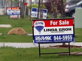 For sales signs line a street in Windsor on Wednesday, May 14, 2008.