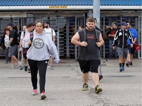 FCA employees stream out from the Windsor Assembly Plant in Windsor on Tuesday, Oct. 11, 2016.