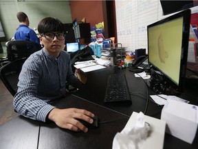 International student Beomjum Kim works on his computer at Laval Tool in Windsor on Oct. 11, 2016.