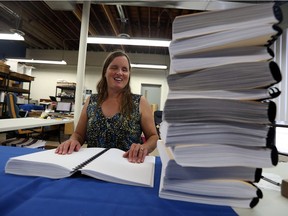 Rebecca Blaevoet looks over the braille council agenda at her office in Windsor on Oct. 18, 2016. Blaevoet had requested a braille copy of the regular council meetings.