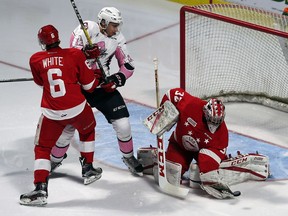 Windsor Spitfires Gabriel Vilardi is pushed in front of the net by Sault Ste. Marie Greyhounds Colton White as goaltender Joseph Raaymakers makes a save during OHL action at the WFCU Centre on Oct. 27, 2016.