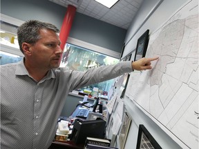 City engineer Mark Winterton looks over a map of the Windsor sewer system at his office in Windsor on Tuesday, Oct. 4, 2016.