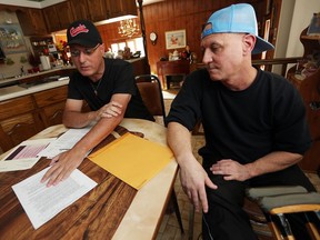 John Carlini, left, and his brother Frank talk about Frank's spending at a local tanning salon in Windsor on Thursday, Oct. 6, 2016. Frank, who is intellectually disabled, spent thousands of dollars, in cash, to buy tanning minutes but due to illness he can no longer use them. John is upset On the Dark Side tanning salon refuses to refund his money.