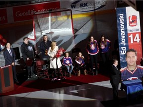 Former Windsor Spitfire Ed Jovanovski, left, watches as a banner in his name is raised at the WFCU Centre on Jan 17, 2015.