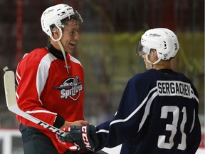 Windsor Spitfires Logan Stanley, left, chats with Mikhail Sergachev after three-on-three drills at the WFCU Centre on Aug. 30 2016.