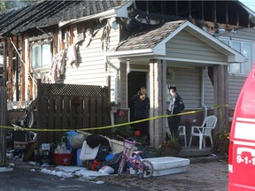 Windsor Fire investigators are searching for clues into the cause of a house fire on Memorial Drive in Windsor, Ont., on Oct. 19, 2016.
