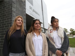 St. Joseph's students Kelsey Bois, left, Katrina Bahnam and Kyla Kahoy stand in front of the east Windsor school on Oct. 20, 2016.