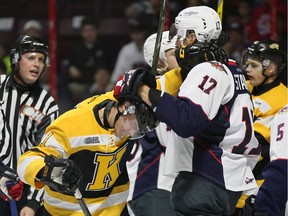 Windsor Spitfires Logan Stanley, right, tussles with Kingston Frontenacs Zack Dorval in OHL action from the WFCU Centre on Oct. 20, 2016.