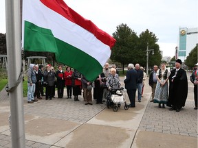 The Hungarian flag is raised during a ceremony at Windsor City Hall on Oct. 21, 2016.