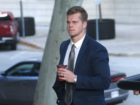 Former Windsor Spitfire Ben Johnson walks towards the the Superior Court of Justice in Windsor, Ont. on Oct. 24, 2016.  Johnson will be sentenced in a sexual assault case.