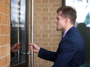 Ben Johnson opens the door at Ontario Superior Court of Justice in Windsor before his sentencing hearing on Oct. 25, 2016.
