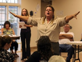 Harmony in Action president Dawn Melville calls an end to the annual general meeting after a heated debate on Oct. 5, 2016.