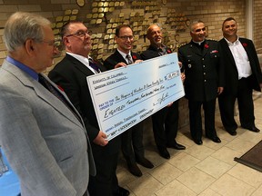 Father Matthew Durham (third from right) from Hospice is presented with a cheque by members of the Knights of Columbus LeRoy Eid, John Swizawski, Michael Agius, Elie Zouein and John P. Semaan (left to right) in Windsor on Monday, November 7, 2016. The local chapters raised $18,453 which was presented to The Hospice of Windsor and Essex County. The Knights of Columbus have donated more than $280,000 to the hospice over the past 19 years.