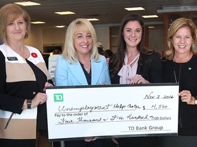 The TD Bank at Tecumseh and Lauzon presented a cheque for $4,500 to the Unemployed Help Centre's Food Bank and Coats For Kids Program on Thursday, November 3, 2016. Karen Jean, branch manager, left, June Muir, CEO of the Unemployed Help Centre, Heidi Janzen, Coats for Kids coordinator and Anna Iacobelli, senior vice-president western Ontario region for TD Bank are shown during the presentation.