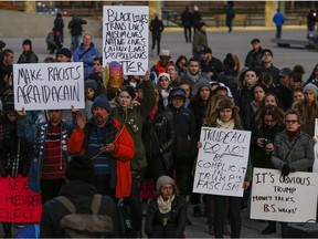 About 300 anti Trump protesters marched up University Ave. in Toronto to end up at the front of the American consulate on Sunday November 13, 2016. Dave Thomas/Toronto Sun/Postmedia Network