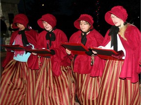 A choir of student volunteers from General Amherst high school sing at the River Lights Winter Festival in November 2010.