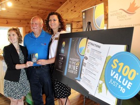 Joanne Wolnika product development officer, Ontario Southwest Tourism Corporation, left; Tom O'Brien, past president, Essex Pelee Coast Winegrower Association and co-owner of Cooper's Hawk Vineyards; and Lynette Bain, vice-president of Tourism Programs & Development, Tourism Windsor Essex Pelee Island announce the Passport to Epic Wine Country on June 11, 2015.