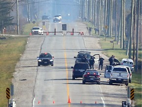Amherstburg police accident reconstruction team members investigate a fatal accident on County Road 18 in Amherstburg, Ont., on Nov. 17, 2016.