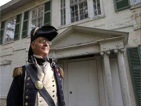 Artist Peter Rindlisbacher, dressed in War of 1812 military garb, announces donation of a painting of Belle Vue House to help fund local restoration efforts. The announcement was made at the Belle Vue house in Amherstburg  on Nov. 2, 2016.