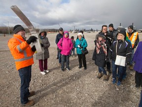 An official on behalf of the Windsor Detroit Bridge Authority provides information during a walking tour at the Canadian Port of Entry of the Gordie Howe International Bridge project.