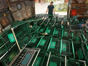 Windsor property owner Josh Bastien shows more than 70 stray shopping carts he collected from his neighbourhood of Pelissier at Erie Street. Photographed Nov. 2, 2016.