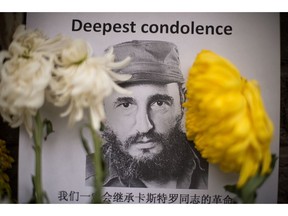 Picture taken a the entrance of the Cuban embassy where floral wreaths lay, four days after Cuban revolutionary leader Fidel Castro died, in Beijing, on November 29, 2016.   The urn containing Fidel Castro's ashes was shown on Cuban television for the first time during a private ceremony led by his brother and successor, President Raul Castro. /