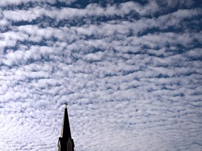 The peak of the St. Alphonsus Church in downtown Windsor is contrasted against a formation of altocumulus clouds on Monday, Nov. 14, 2016.