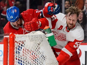 Red Wings defenceman Niklas Kronwall, right, battles Montreal Canadiens forward Mike Brown at the Bell Centre on March 29, 2016 in Montreal.