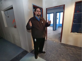 Ron Dunn, executive director of the Downtown Mission, leads a tour of their new facilities at 875 Ouellette Ave., on Nov. 25, 2016.