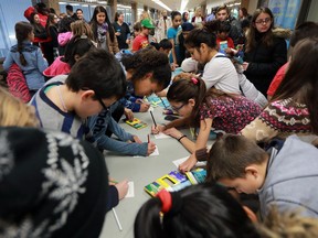 The FINA World Swimming Championships organizing committee held a media conference on Nov 22, 2016, to announce details of the Feel the Heats program which will allow 4,000 local students to attend championship heats at the event. Roseville Public School students fill out welcome cards for the visiting athletes during the event.