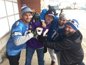 Detroit Lions and Minnesota Vikings fans wait for the Windsor-Detroit Tunnel bus ahead of the American Thanksgiving football game on Nov. 24, 2016.