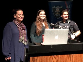 Homeless Coalition spokeswoman Angela Yakonich, left, University of Windsor student Megan Stark and Const. Monique Bergeron speak to students at Lajeunesse high school about youth homelessness on Monday, Nov. 21, 2016.