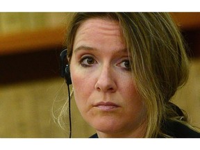 Katie Telford, chief of staff to Prime Minister Justin Trudeau, takes part in a meeting with Chinese Premier Li Keqiang (not pictured) in the cabinet room on Parliament Hill in Ottawa on Thursday, Sept. 22, 2016. Justin Trudeau's two top aides are repaying a "significant portion" of the $207,000 they received for moving expenses, hoping to douse a controversy that has plagued the Liberal government since the outset of the fall parliamentary sitting.