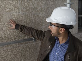 Atif Suhail, project manager for Public Works and Government Services Canada, talks about a discovered fossil on the exterior facade of the  historic Paul Martin Building in downtown Windsor, Saturday, Nov. 12, 2016.