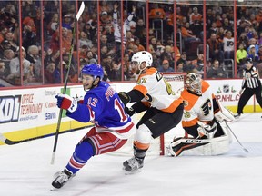New York Rangers' Matt Puempel, left, celebrates his goal against the Philadelphia Flyers Friday, Nov. 25, 2016, in Philadelphia.