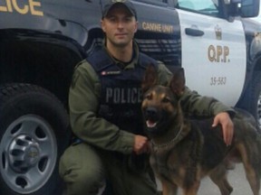 Ontario Provincial Police Const. Milan Matovski and his partner Maximus are pictured in this handout photo.